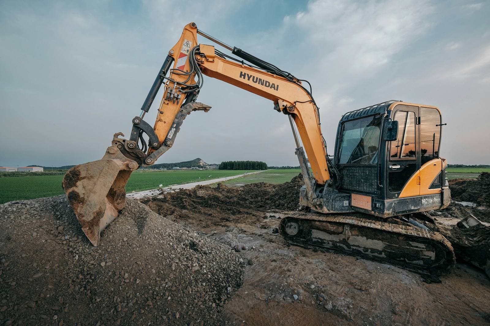 An excavator working a dirt site